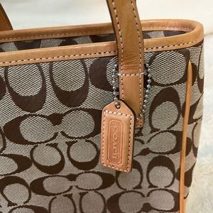 Coach monogram small handbag with leather strap, inside zip pocket